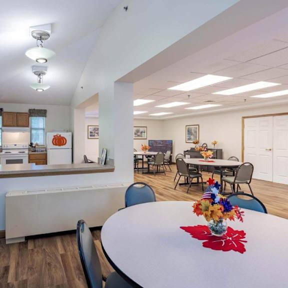 a kitchen with a table set for a meal.