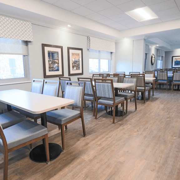 a room with a long table and chairs.