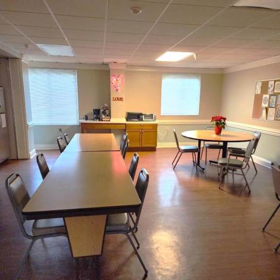 a conference room with a long table and chairs.
