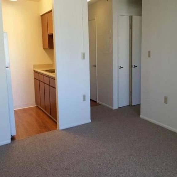 a room with a carpeted floor and white walls.