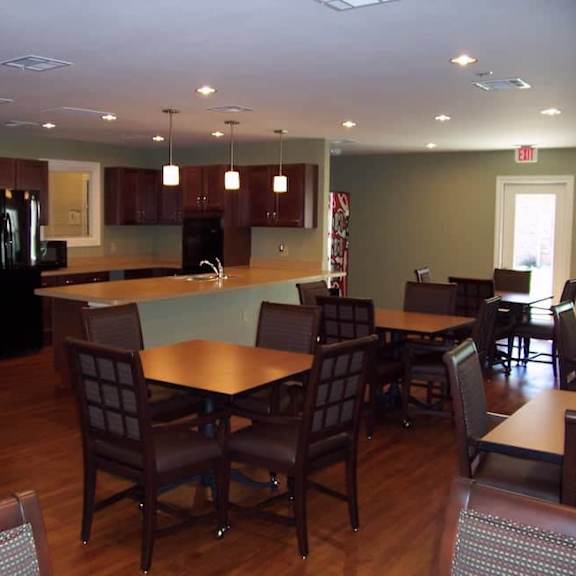 a kitchen with a table and chairs.