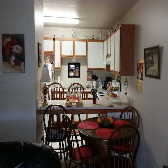 a kitchen with a table and chairs.