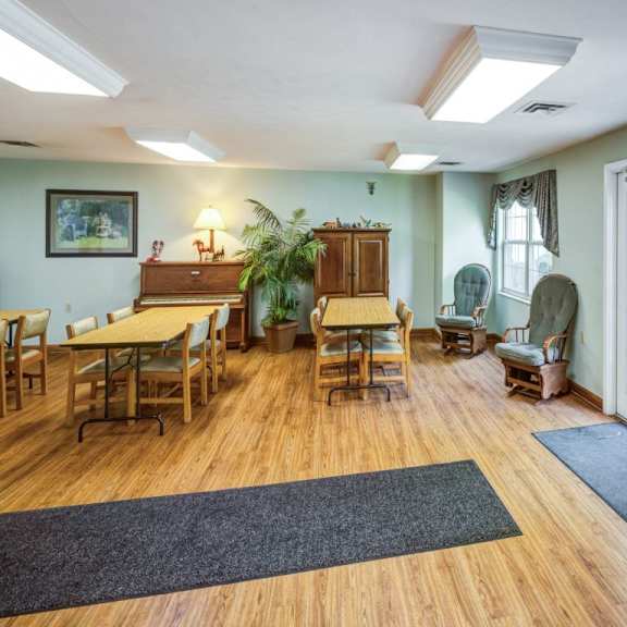 a room with wooden floors and furniture.