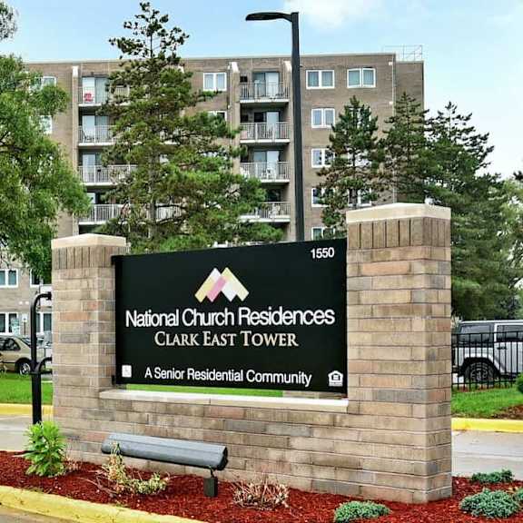 the sign in front of the building says national church residences.