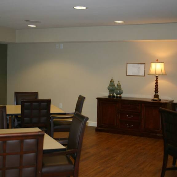 a conference room with a long table and chairs.