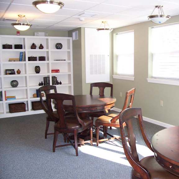 a room with a dining table and chairs.