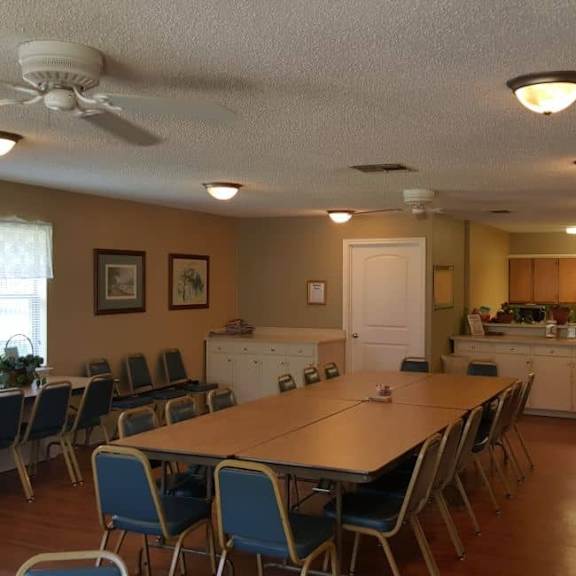 a dining room with a table and chairs.