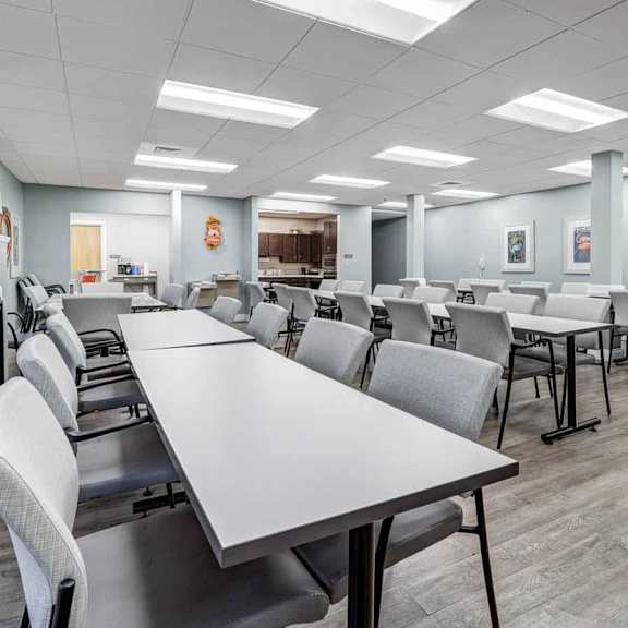 a conference room with a long table and chairs.