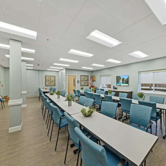 a conference room with a long table and chairs.
