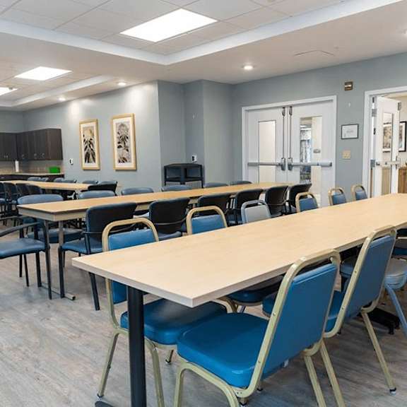 a conference room with a long table and chairs.