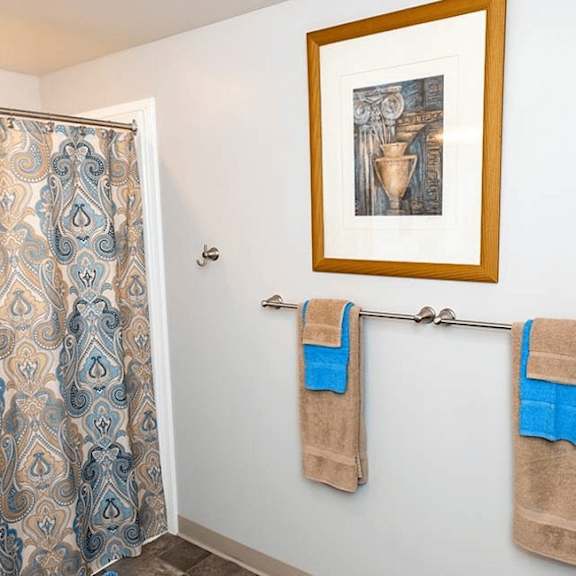 two towels are hanging on a towel bar.