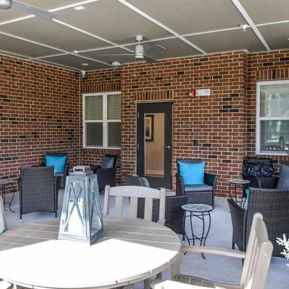 a patio with a table and chairs.