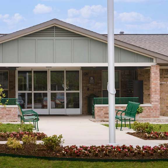 a building with a green pole in front of it.