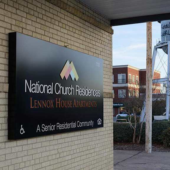 a sign for national church residences lennox house awards is displayed on a building.
