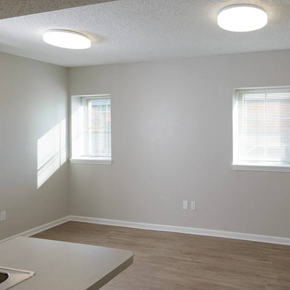 a room with a window and a sink.
