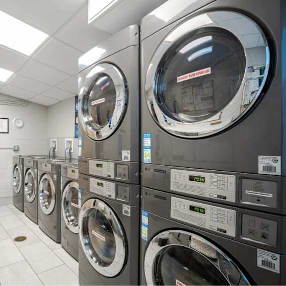 a row of washing machines in a laundromat.