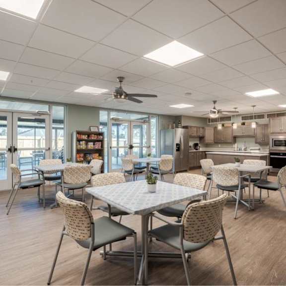 a dining room with a table and chairs.