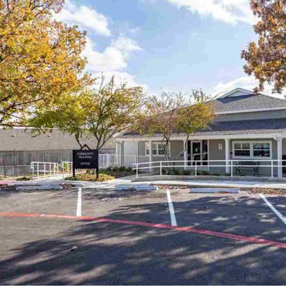 a building with a parking lot in front of it.