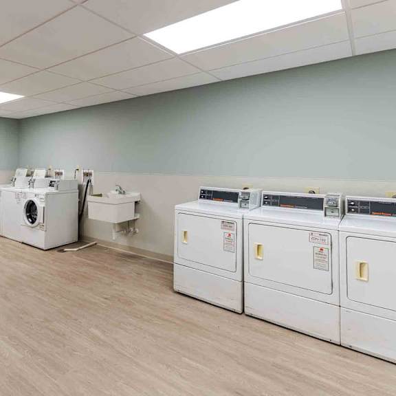 a room with a whiteboard and several pieces of industrial equipment.