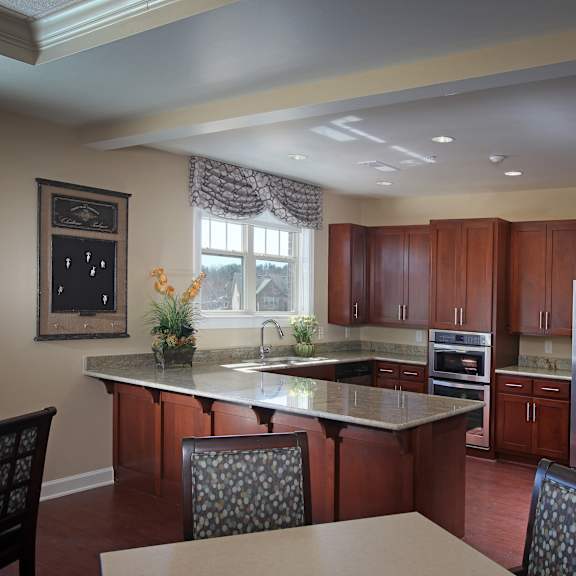 a kitchen with wooden cabinets and a large island.