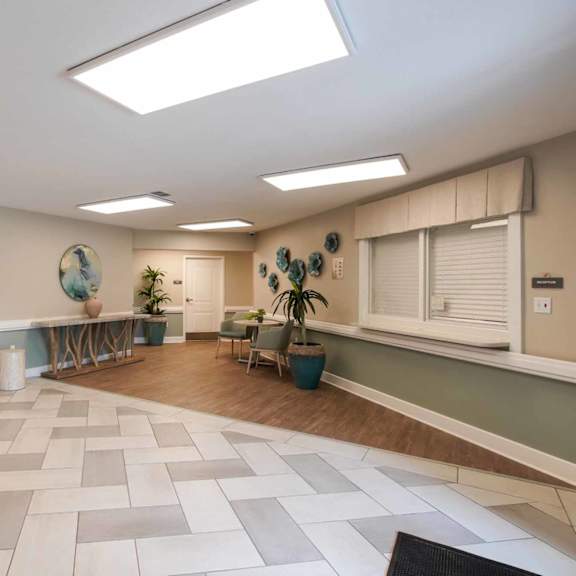 a spacious room with a tiled floor and a skylight.