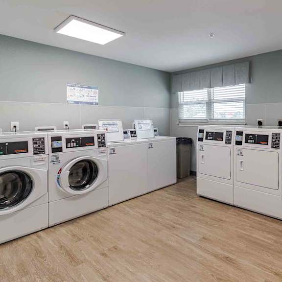 a row of washing machines in a laundromat.