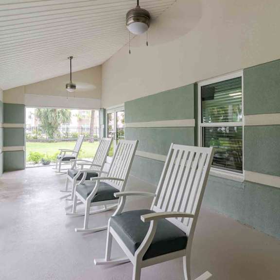 a row of chairs are lined up in a waiting area.
