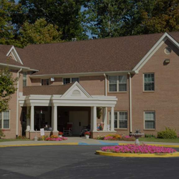 a brick building with a white entrance.