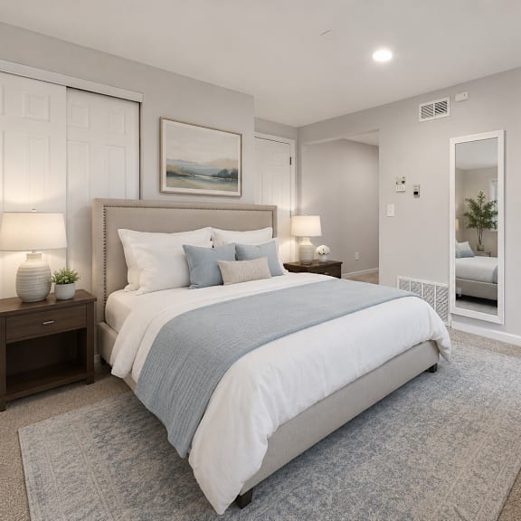 a bedroom with a large bed and a painting on the wall.
