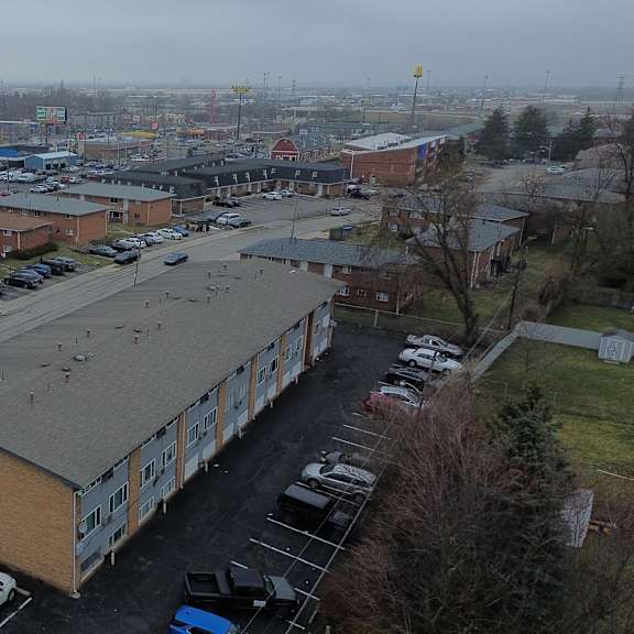 a parking lot with a building in the middle.
