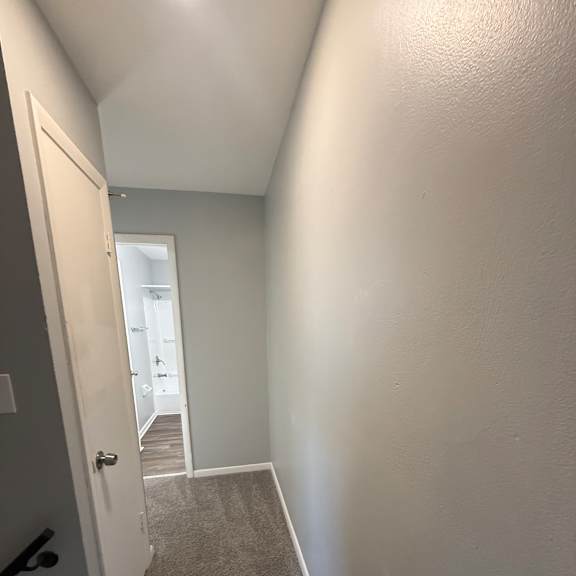 a bathroom with a white sink and a window.