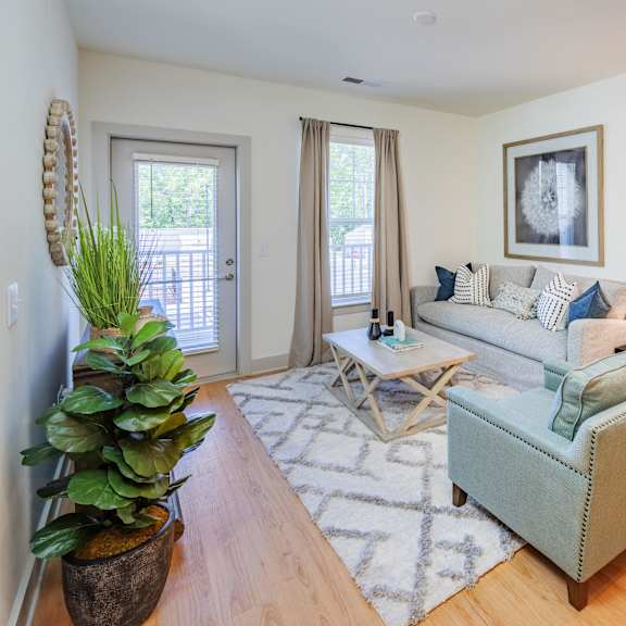 spacious living room with modern furnishings in a huntersville apartment