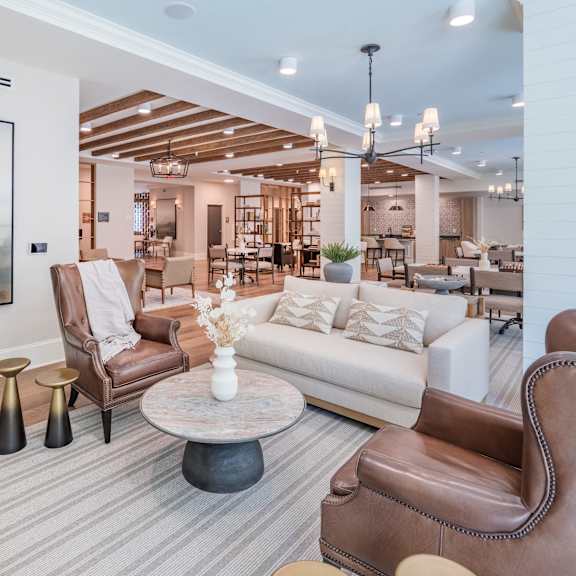couch and side chairs in the arden at huntersville resident social lounge