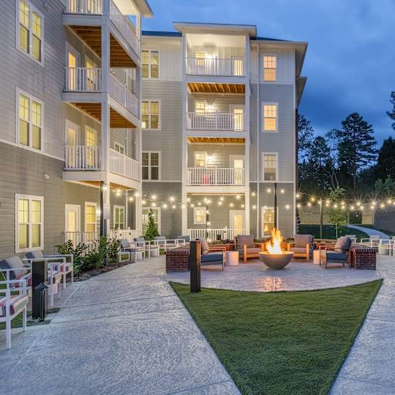 walkway leading to the lounge outside of arden at huntersville's 55+ apartment building