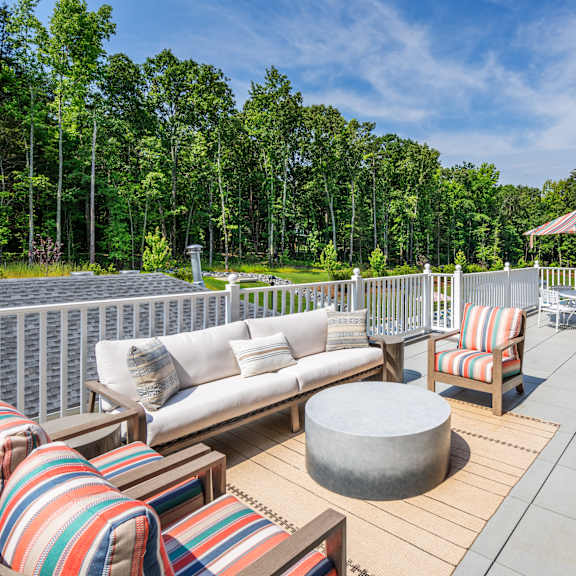 seating area on an terrace outside arden at huntersville 55+ community