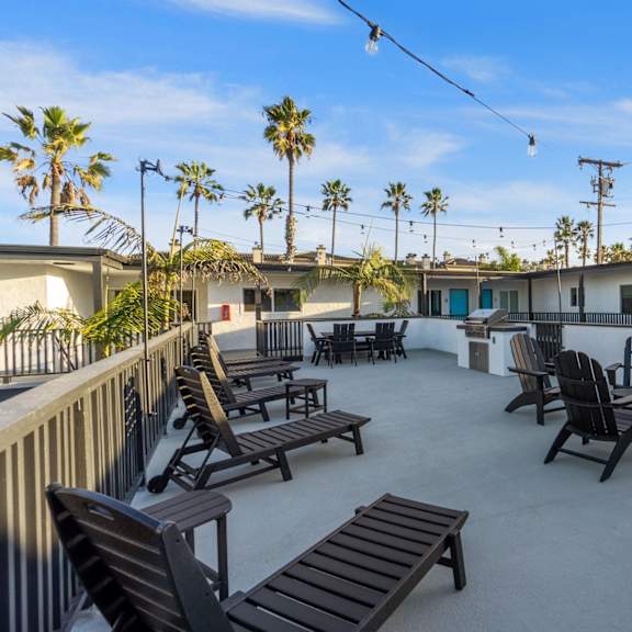 deck with bbq and chairs at ocean breeze terrace apartment, california