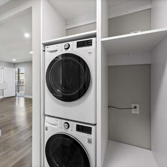a washer and dryer in a laundry room in a house at ocean breeze terrace apartment, huntington beach, california