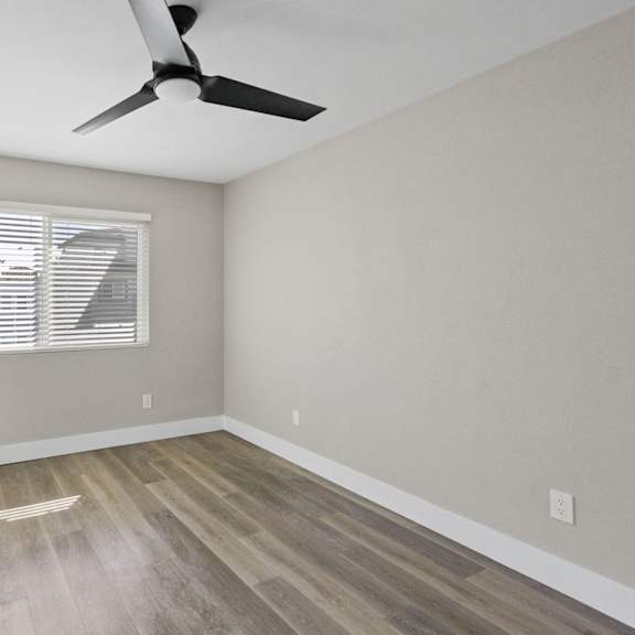 bedroom with ceiling fan at ocean breeze terrace apartment, huntington beach, ca, 92648
