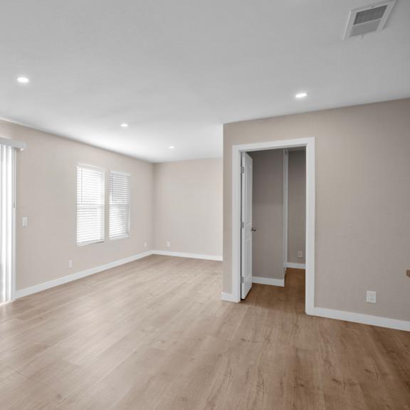 a room with a wooden floor and a sliding door.