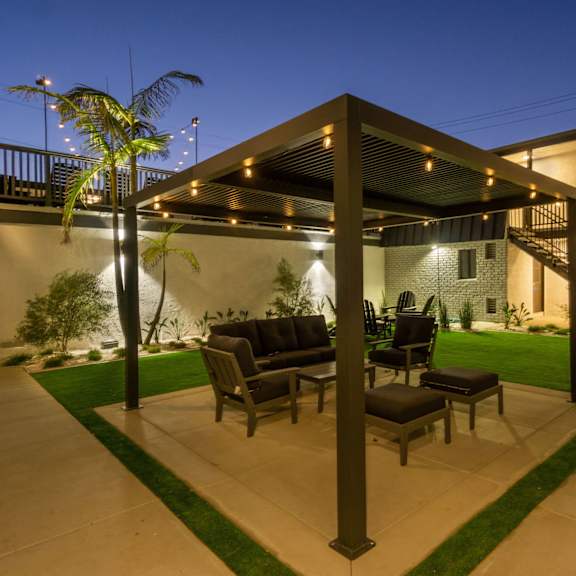 pergola with seating outdoor at ocean breeze terrace apartment, huntington beach, 92648