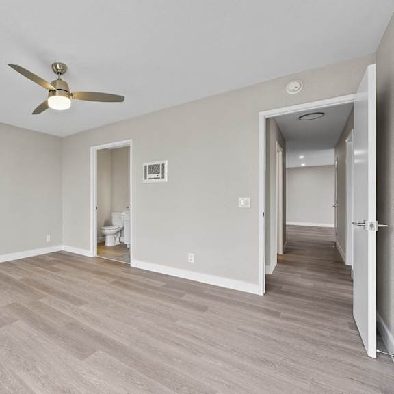 a room with a ceiling fan and light fixture at tamarack sands apartment homes, carlsbad, 92008