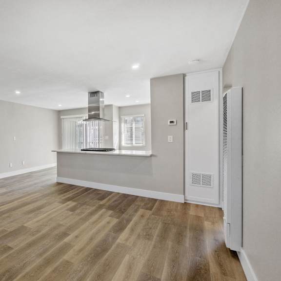 renovated kitchen and living room at ocean breeze terrace apartment, california, 92648