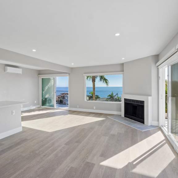 a spacious living room with a fireplace at ocean edge @ laguna beach, laguna beach, 92651