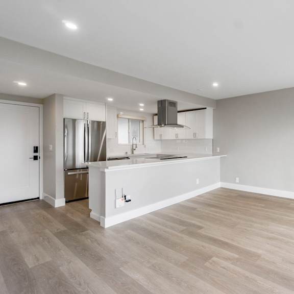 a kitchen with a refrigerator, sink, and stove.at ocean edge @ laguna beach, laguna beach, 92651
