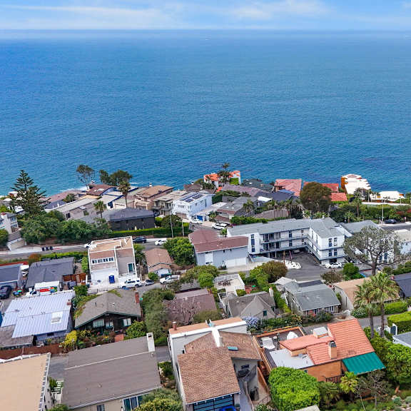 a coastal residential area with houses and trees.at ocean edge @ laguna beach, laguna beach california