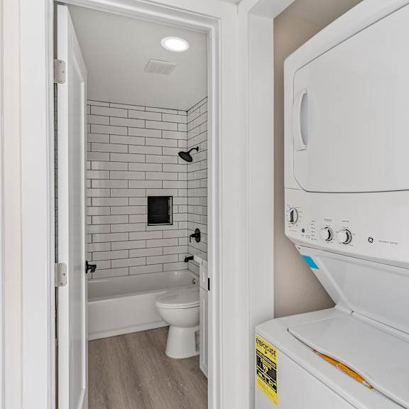 a washer and dryer in a bathroom at seaview terrace apartment homes, california