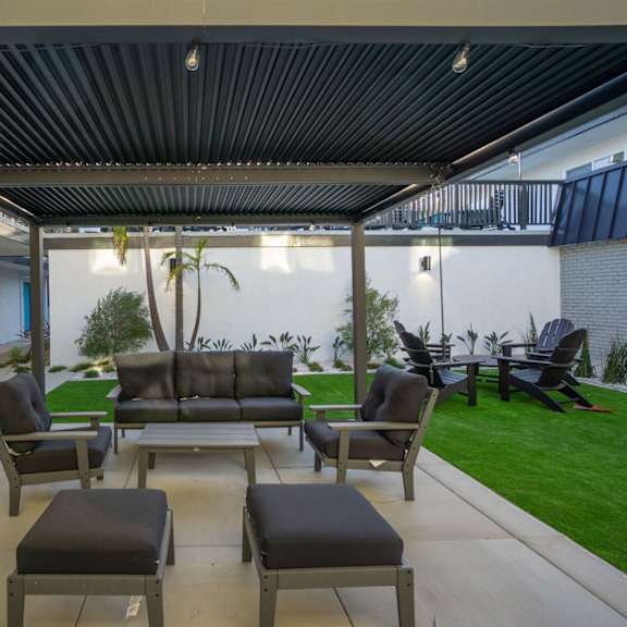 pergola with seating area at ocean breeze terrace apartment, huntington beach, ca, 92648