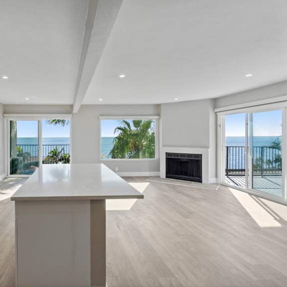 a modern kitchen with a large island at ocean edge @ laguna beach, laguna beach
