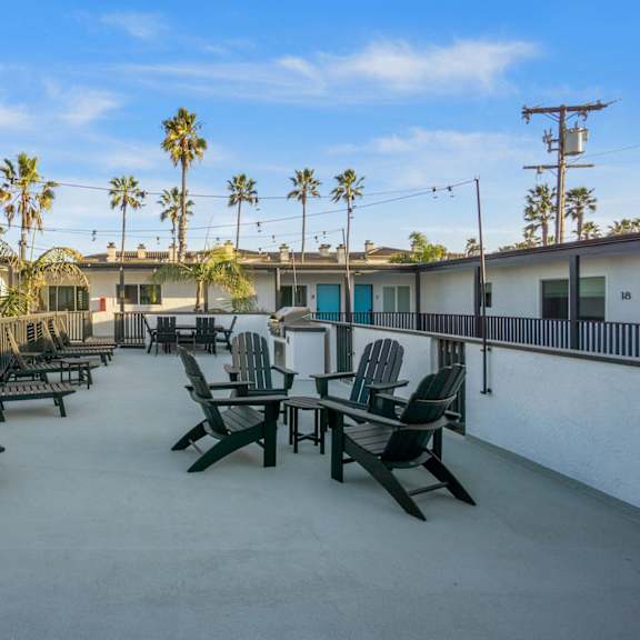 deck with seating and bbq at ocean breeze terrace apartment, huntington beach, ca