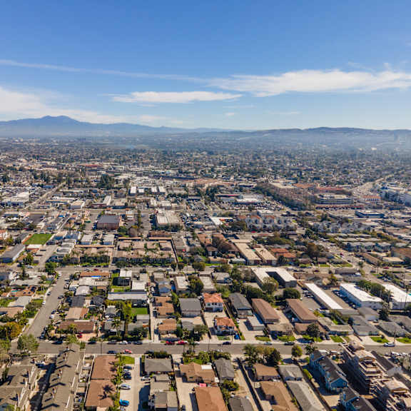 a cityscape with a clear blue sky above.